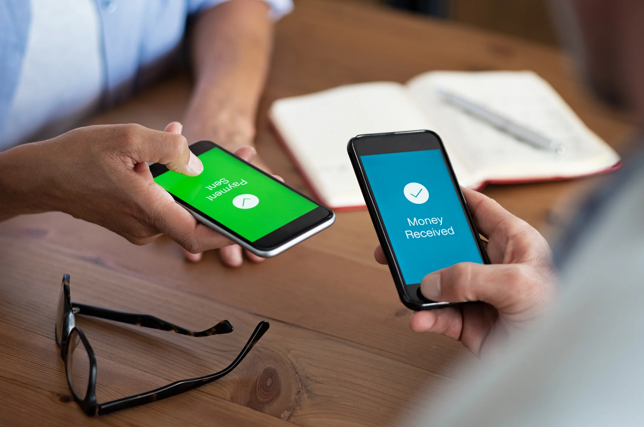 Customers transferring money using mobile payment apps
